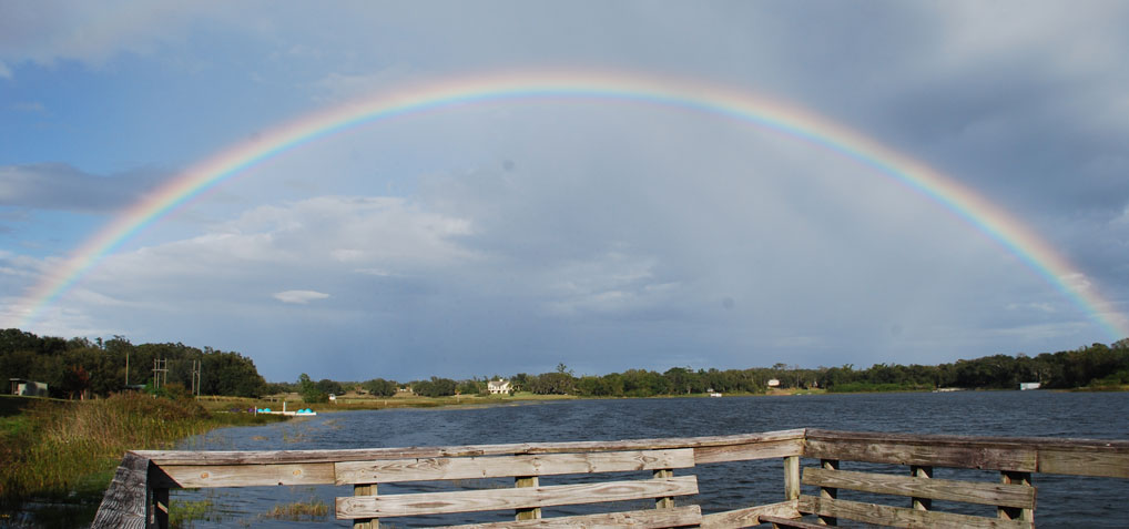 A rainbow over the lake, reminding us of God's promises